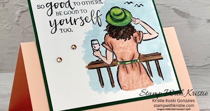Sneak Peek of my blog post using the In the Moment Stamp set. A female standing at a railing with a glass of wine in her left hand looking out at the ocean.